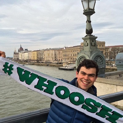 student holding up whoosh scarf in Budapest.